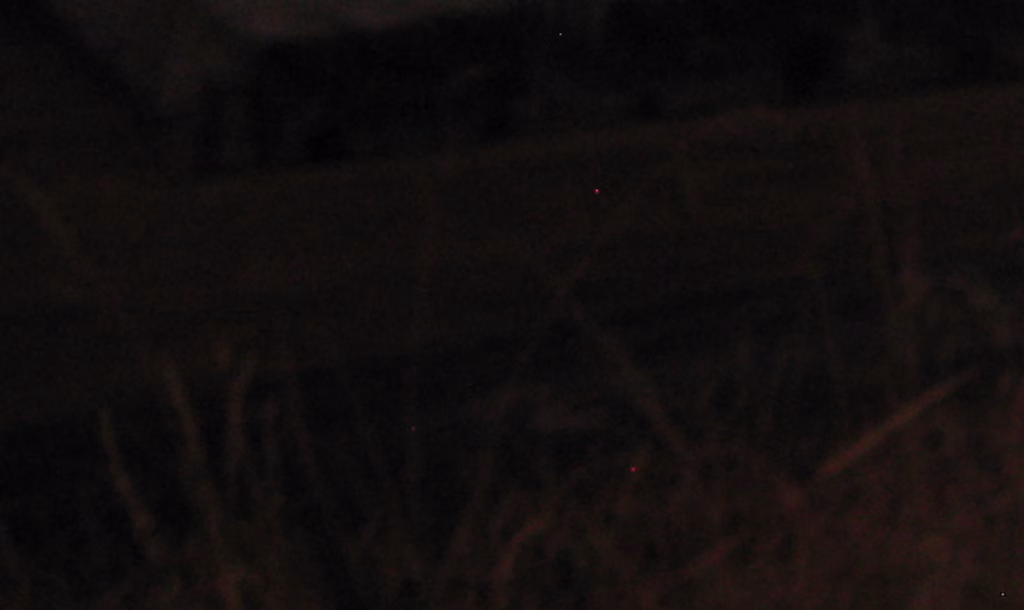 100x crop of a Canon R5 photo showing red hot pixels in a long exposure shot.