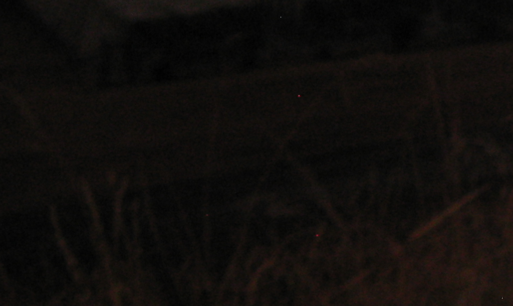 100x crop of a Canon R5 photo showing red hot pixels in a long exposure shot.
